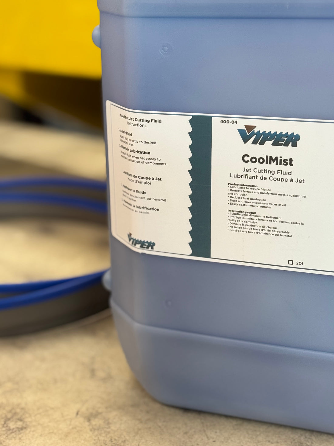 Viper CoolMist Jet Cutting Fluid 20L jug in industrial shop setting