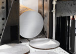 Arntz X-CELL M42 bi-metal bandsaw blade cutting solid round steel stock in industrial band saw machine

